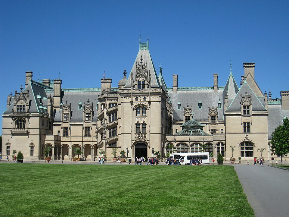 The front façade of Biltmore House in pale limestone beneath steep slate roofs
