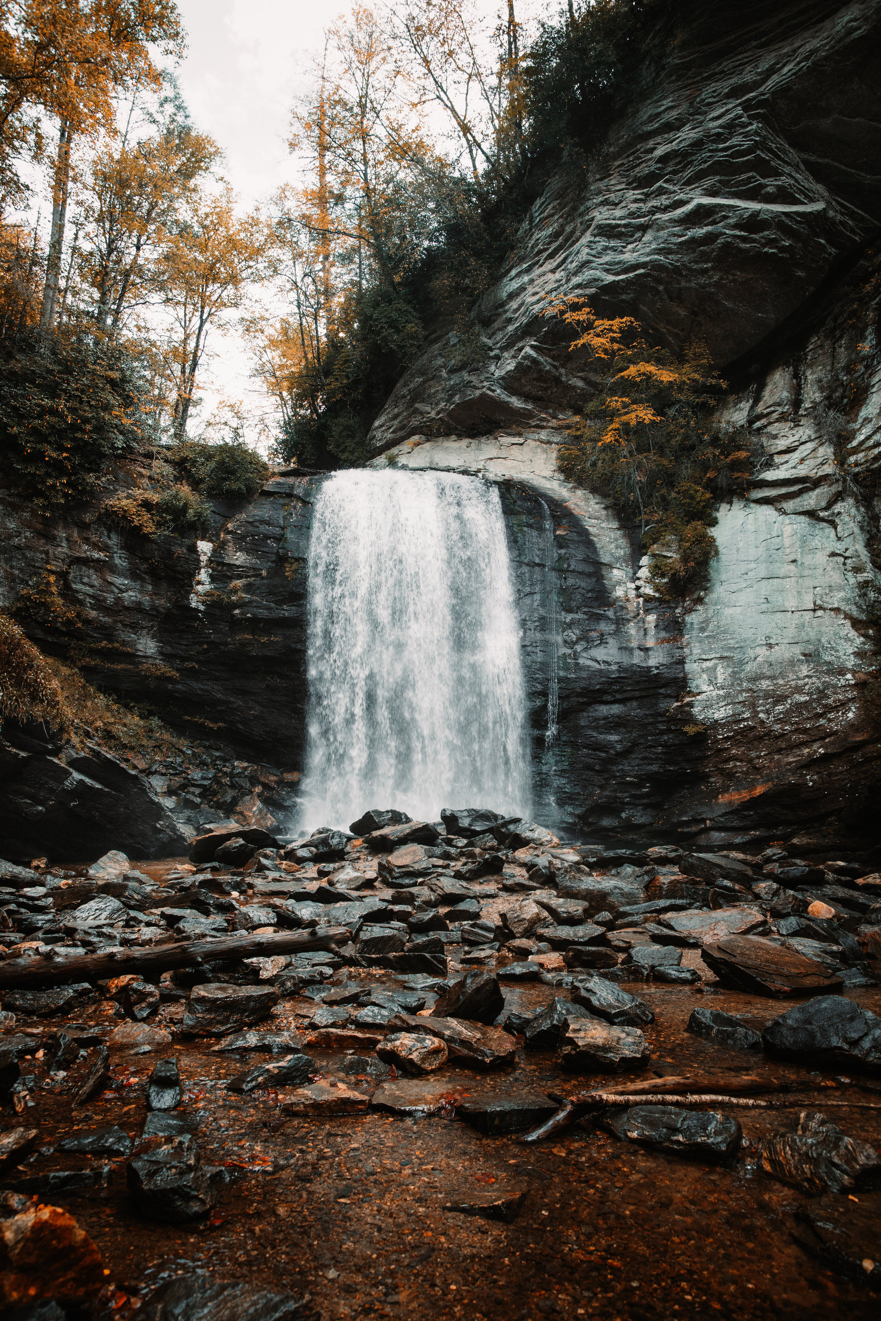 Looking Glass Falls pouring over its granite ledge in autumn, deep in Pisgah National Forest