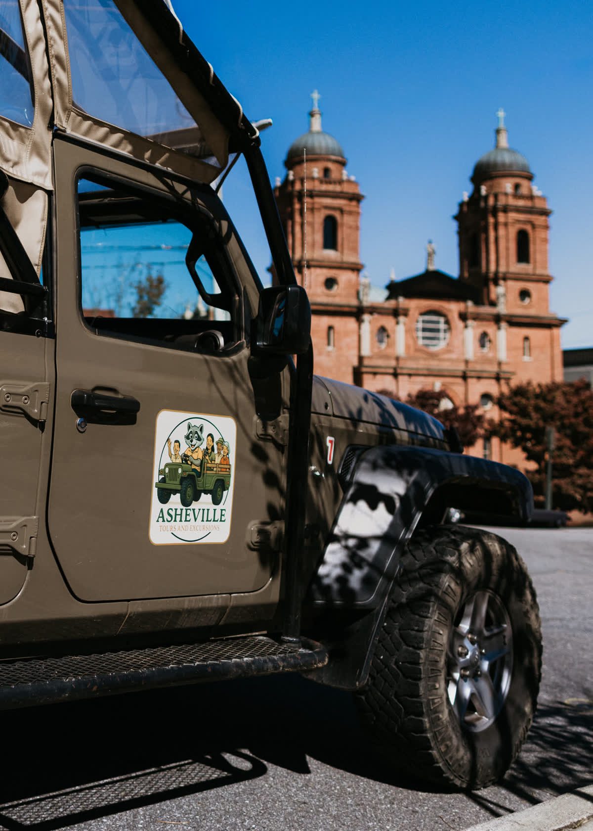 The Basilica of Saint Lawrence, framed off the door of the Jeep you are riding in.